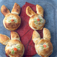 biscuits shaped into bunnies on an air fryer basket