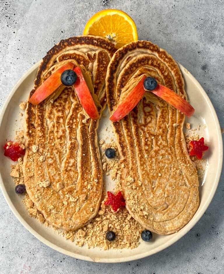 protein pancakes shaped like flip flops decorated with fresh fruit
