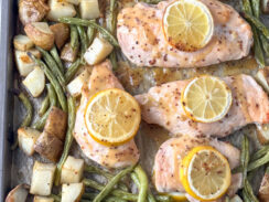chicken breasts, green beans, and potatoes smothered with honey mustard glaze on a sheet pan