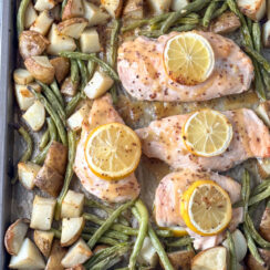 chicken breasts, green beans, and potatoes smothered with honey mustard glaze on a sheet pan