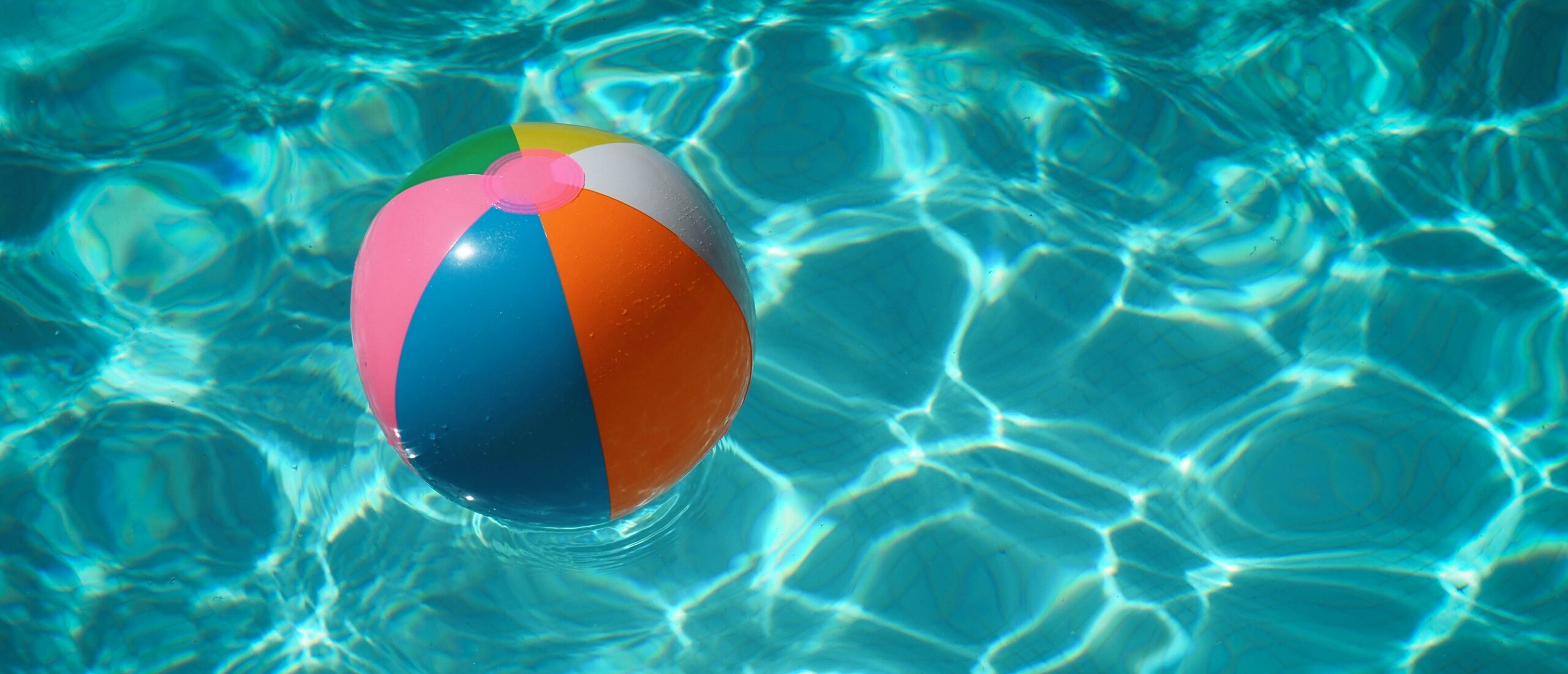 summer pool with a beach ball