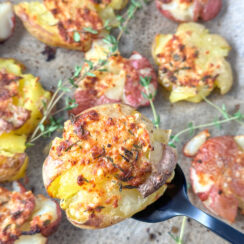 air fried smashed baby red and yellow potatoes with fresh thyme leaves