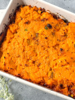 shepherd's pie with sweet potatoes in a white baking dish