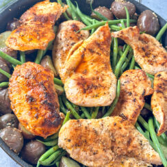 pan seared chicken breasts in a garlic butter sauce with green beans and potatoes