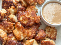 homemade chicken nuggets served with easy to make chick fil a dipping sauce on a round white serving dish