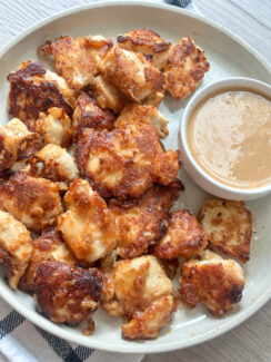 homemade chicken nuggets served with easy to make chick fil a dipping sauce on a round white serving dish