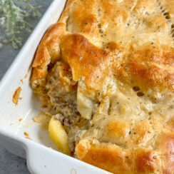 apple and sausage pie made with crescent rolls in a white baking dish