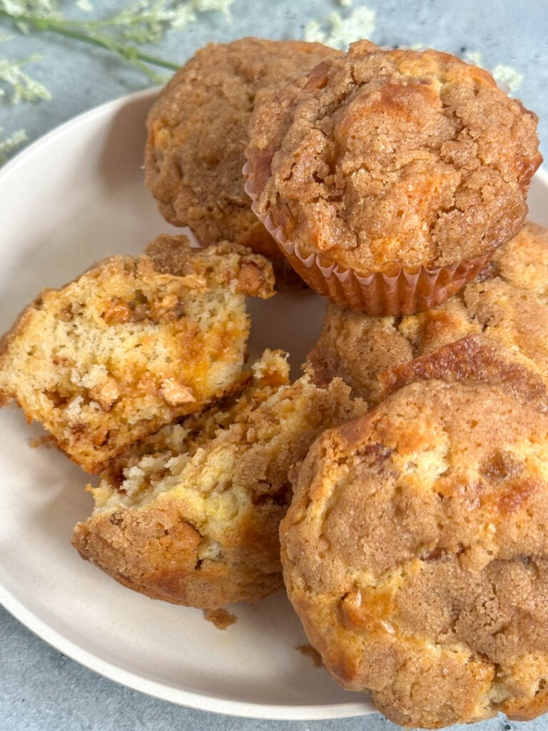 delicious and easy box cinnamon streusel muffins with melted butterscotch chips on a white serving dish