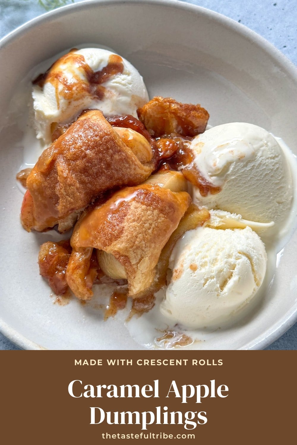 Caramel apple dumplings made with crescent rolls served with vanilla ice cream