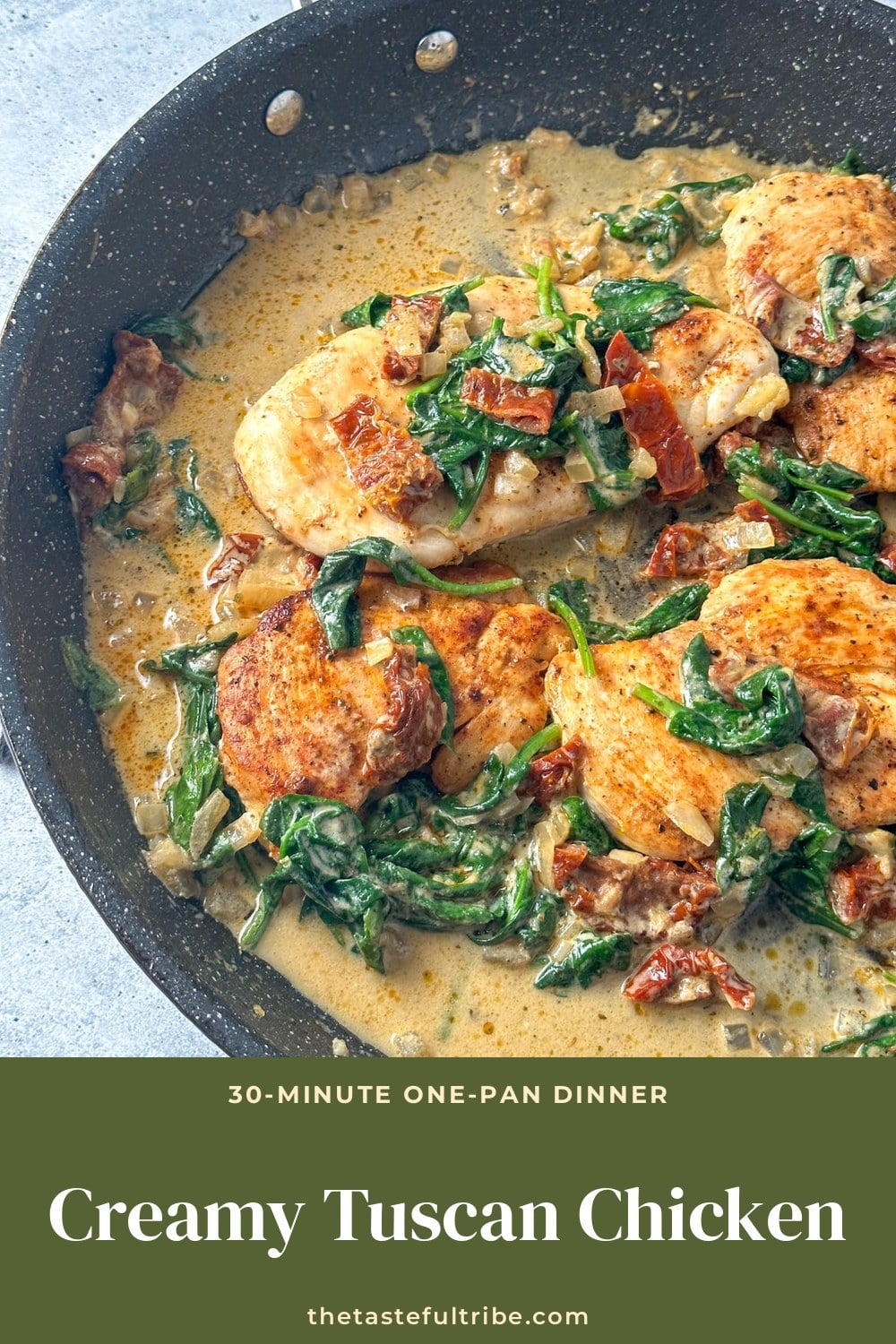 Creamy Tuscan chicken with spinach and sun-dried tomatoes in a skillet