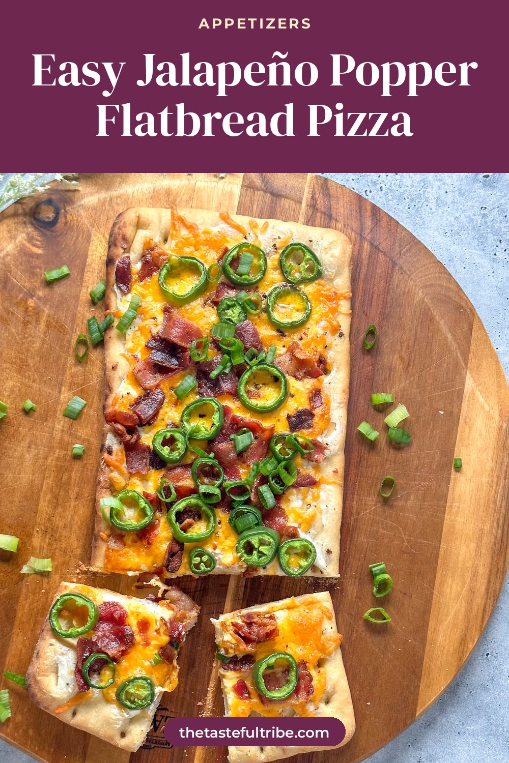 flatbread pizza with cream cheese, melted cheddar cheese, crispy bacon, jalapeño slices, and green onions