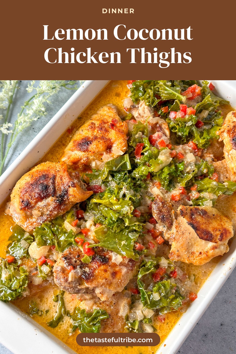 crockpot chicken thighs in a white baking dish with creamy coconut lemon sauce and kale